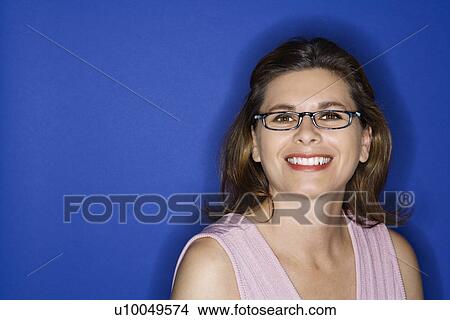 Caucasian prime adult female wearing eyeglasses smiling. View Large Photo Image Picture - Caucasian prime adult female wearing eyeglasses smiling.. Fotosearch