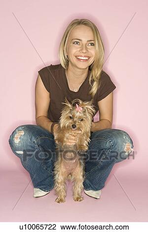 Stock Image - Caucasian young adult female with Yorkshire Terrier dog.. Fotosearch