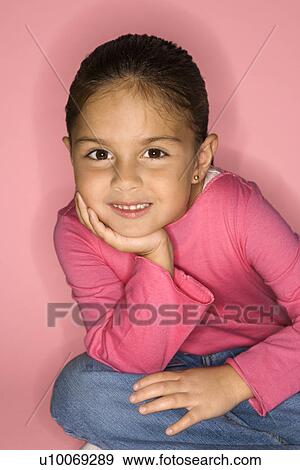 Female Hispanic girl sitting looking at viewer. View Large Photo Image Stock Photo - Female Hispanic girl sitting looking at viewer.. Fotosearch