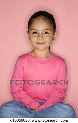 Female Hispanic girl sitting looking at viewer. View Large Photo Image Stock Photograph - Female Hispanic girl sitting looking at viewer.. Fotosearch