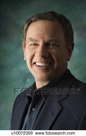 Middle-aged Caucasian man on studio background. View Large Photo Image Stock Photo - Middle-aged Caucasian man on studio background.. Fotosearch