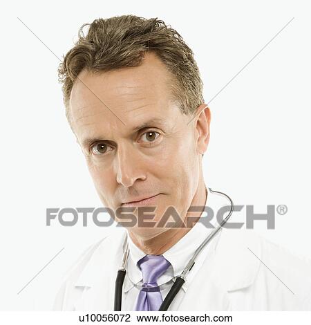 Stock Image - Portrait of a mid-adult Caucasian male doctor with stethoscope around his neck.. Fotosearch