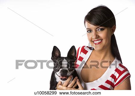 Young adult female Caucasian holding Boston Terrier dog. View Large Photo Image Stock Photo - Young adult female Caucasian holding Boston Terrier dog.. Fotosearch