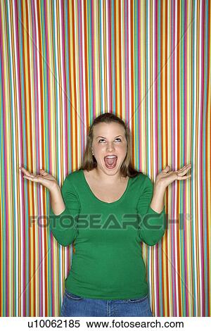 Young Caucasian female adult shrugging and making facial expression. View Large Photo Image Stock Photography - Young Caucasian female adult shrugging and making facial expression.. Fotosearch