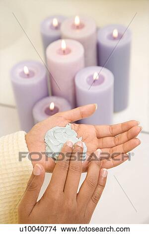 Asian/Indian young womans hands with facial scrub. View Large Photo Image Picture - Asian/Indian young womans hands with facial scrub.. Fotosearch
