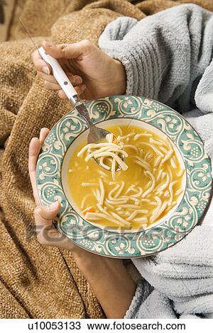 Bowl of chicken noodle soup held in Caucasian/Hispanic hands. View Large Photo Image Stock Image - Bowl of chicken noodle soup held in Caucasian/Hispanic hands.. Fotosearch
