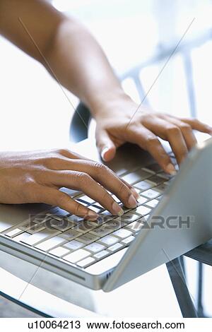 Asian/Indian young womans hands typing on laptop keyboard. View Large Photo Image Stock Image - Asian/Indian young womans hands typing on laptop keyboard.. Fotosearch