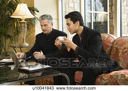 Prime adult Asian and Caucasian businessmen. View Large Photo Image Stock Image - Prime adult Asian and Caucasian businessmen.. Fotosearch