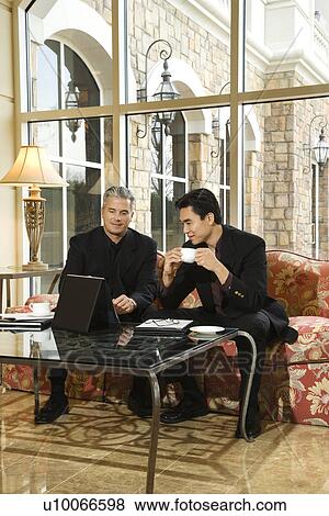 Prime adult Asian and Caucasian businessmen. View Large Photo Image Stock Photo - Prime adult Asian and Caucasian businessmen.. Fotosearch