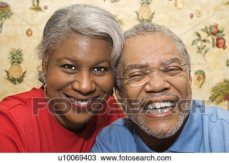 Close up portrait of mature African American couple smiling at viewer. View Large Photo Image Stock Image - Close up portrait of mature African American couple smiling at viewer.. Fotosearch