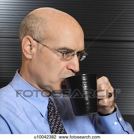 Caucasian middle-aged businessman drinking from coffee cup. View Large Photo Image Stock Image - Caucasian middle-aged businessman drinking from coffee cup.. Fotosearch