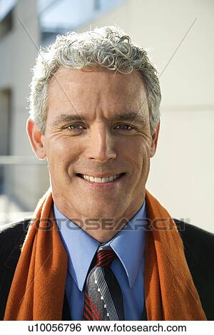 Close up of prime adult Caucasian man in suit looking at viewer smiling. View Large Photo Image Stock Photograph - Close up of prime adult Caucasian man in suit looking at viewer smiling.. Fotosearch