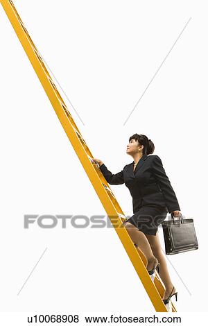 Stock Photo - Filipino middle-aged businesswoman climbing ladder carrying briefcase.. Fotosearch
