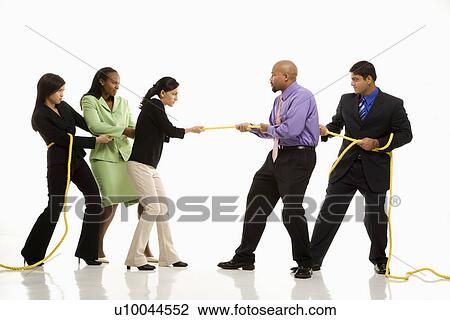 Multi-ethnic businessmen playing tug of war against businesswomen. View Large Photo Image Stock Image - Multi-ethnic businessmen playing tug of war against businesswomen.. Fotosearch