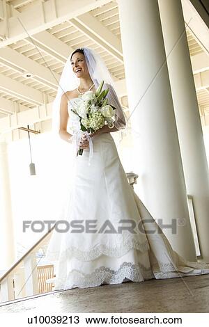 Stock Image - Caucasian mid-adult bride portrait.. Fotosearch