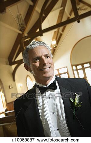 Portrait of mid-adult smiling groom inside a church. View Large Photo Image Stock Photo - Portrait of mid-adult smiling groom inside a church. . Fotosearch