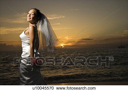 Young adult female Caucasian bride on beach. View Large Photo Image Stock Image - Young adult female Caucasian bride on beach.. Fotosearch