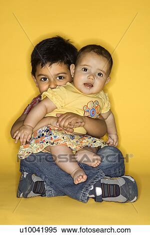 Hispanic and African American male child in cowboy hats shaking hands. View Large Photo Image Stock Photography - Hispanic and African American male child in cowboy hats shaking hands.. Fotosearch