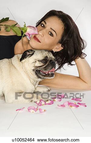 Picture - Caucasian prime adult female with Pug dog.. Fotosearch