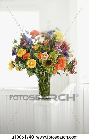 Stock Image - Colorful flowers arranged in vase.. Fotosearch