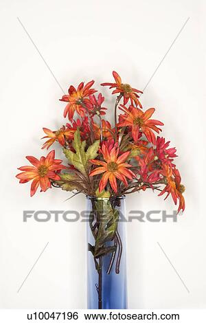 Stock Photograph - Still life shot of fake flowers in a vase.. Fotosearch