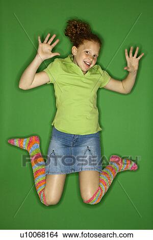Caucasian female child jumping. View Large Photo Image Picture - Caucasian female child jumping.. Fotosearch