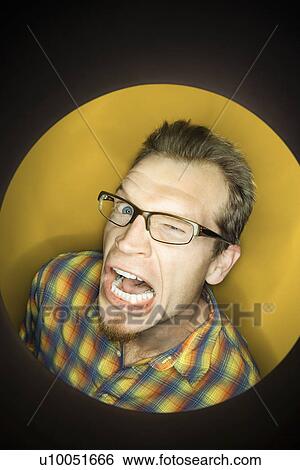Vignette of adult Caucasian man on yellow background winking and making funny face. View Large Photo Image Stock Photograph - Vignette of adult Caucasian man on yellow background winking and making funny face.. Fotosearch