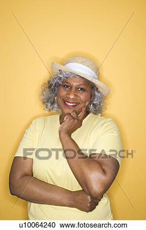 Stock Image - African American female mature adult looking at viewer smiling.. Fotosearch