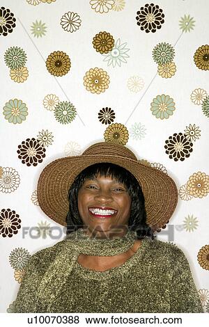 African-American mid-adult woman portrait in front of vintage pattern background. View Large Photo Image Stock Photo - African-American mid-adult woman portrait in front of vintage pattern background.. Fotosearch