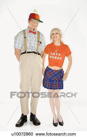 Caucasian young man dressed like nerd wearing propeller hat with Caucasian blonde young woman wearing tshirt reading I love nerds and plaid skirt. View Large Photo Image Stock Image - Caucasian young man dressed like nerd wearing propeller hat with Caucasian blonde young woman wearing tshirt reading I love nerds and plaid skirt.. Fotosearch
