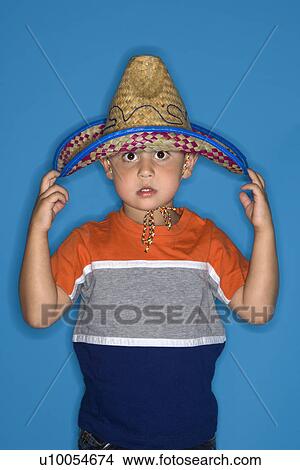 Male Hispanic boy wearing sombrero. View Large Photo Image Picture - Male Hispanic boy wearing sombrero.. Fotosearch