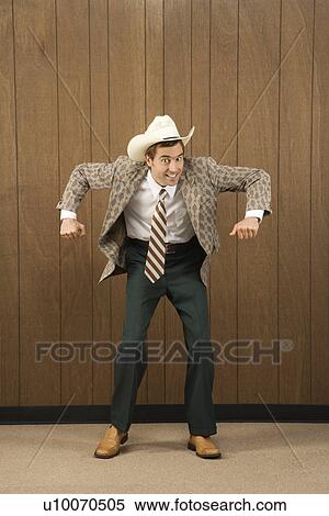 Mid-adult Caucasian male wearing cowboy hat dancing. View Large Photo Image Stock Photography - Mid-adult Caucasian male wearing cowboy hat dancing.. Fotosearch