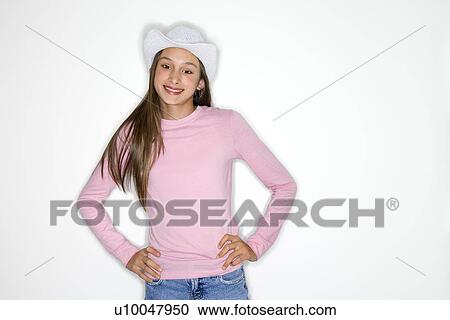 Portrait of Asian-American teen girl with cowboy hat and hands on hips standing in front of white background. View Large Photo Image Stock Image - Portrait of Asian-American teen girl with cowboy hat and hands on hips standing in front of white background.. Fotosearch