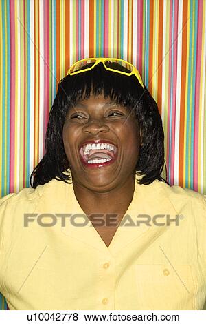 African-American mid-adult woman laughing. View Large Photo Image Stock Photo - African-American mid-adult woman laughing.. Fotosearch