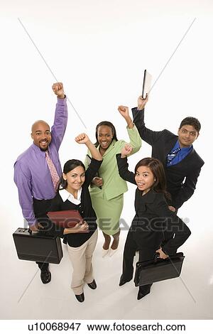 Stock Photo - Portrait of multi-ethnic business group standing holding briefcases and cheering.. Fotosearch