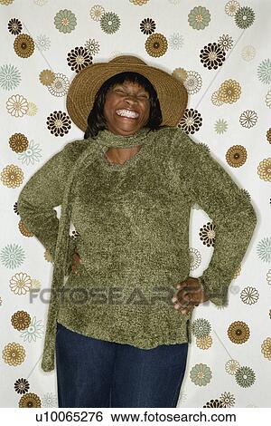 African-American mid-adult woman in front of vintage pattern background. View Large Photo Image Stock Photograph - African-American mid-adult woman in front of vintage pattern background.. Fotosearch