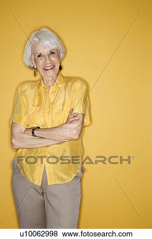 Caucasian mature adult female standing smiling. View Large Photo Image Stock Photo - Caucasian mature adult female standing smiling.. Fotosearch