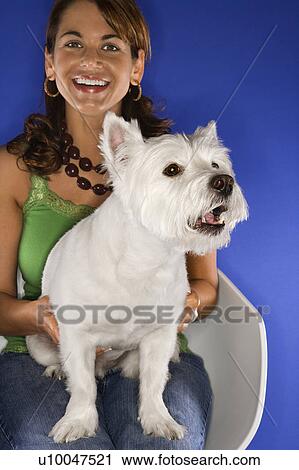 Caucasian prime adult female holding white terrier dog. View Large Photo Image Stock Image - Caucasian prime adult female holding white terrier dog.. Fotosearch