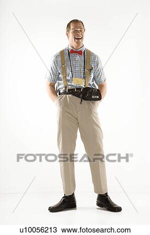 Caucasian young man dressed like nerd smiling with eyes closed. View Large Photo Image Stock Image - Caucasian young man dressed like nerd smiling with eyes closed.. Fotosearch