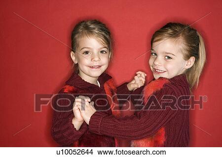 Picture - Female children Caucasian twins standing in dance stance.. Fotosearch