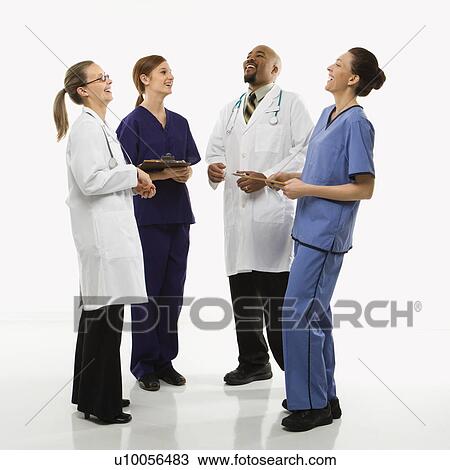 Full-length portrait of African-American man and Caucasian women medical healthcare workers in uniforms laughing standing against white background. View Large Photo Image Stock Image - Full-length portrait of African-American man and Caucasian women medical healthcare workers in uniforms laughing standing against white background.. Fotosearch
