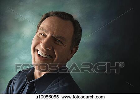 Laughing middle-aged Caucasian man on studio background. View Large Photo Image Stock Photography - Laughing middle-aged Caucasian man on studio background.. Fotosearch