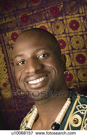 Stock Photo - Portrait of smiling mid-adult African-American man.. Fotosearch