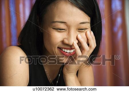 Stock Image - Prime adult Asian female portrait.. Fotosearch