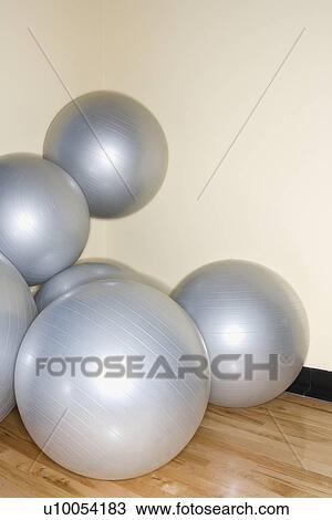 Balance balls stacked in gym. View Large Photo Image Stock Image - Balance balls stacked in gym.. Fotosearch