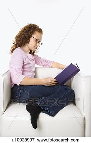 Caucasian female child sitting reading book. View Large Photo Image Stock Photo - Caucasian female child sitting reading book.. Fotosearch