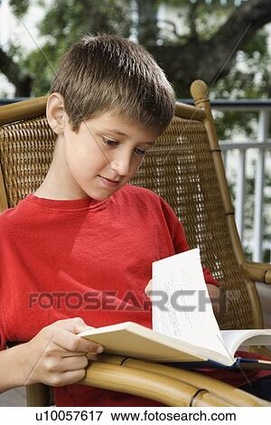 Caucasian pre-teen boy reading book. View Large Photo Image Stock Photo - Caucasian pre-teen boy reading book.. Fotosearch