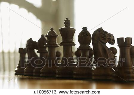 Stock Image - Chess pieces set up on board.. Fotosearch