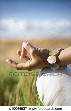 Close-up of young adult Asian female's hands in meditating position. View Large Photo Image Stock Photo - Close-up of young adult Asian female's hands in meditating position.. Fotosearch