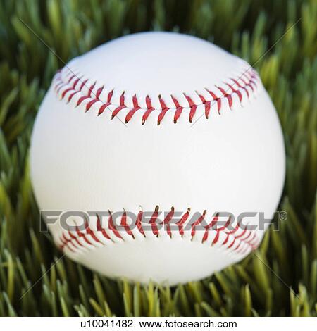 Close-up studio shot of baseball resting in grass. View Large Photo Image Stock Image - Close-up studio shot of baseball resting in grass.. Fotosearch